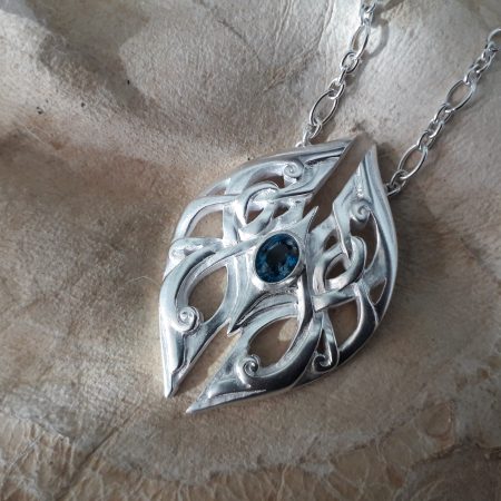 Geminae Danicae Amulet in silver with silver chains. Set with a mesmerizing London blue Topaz.